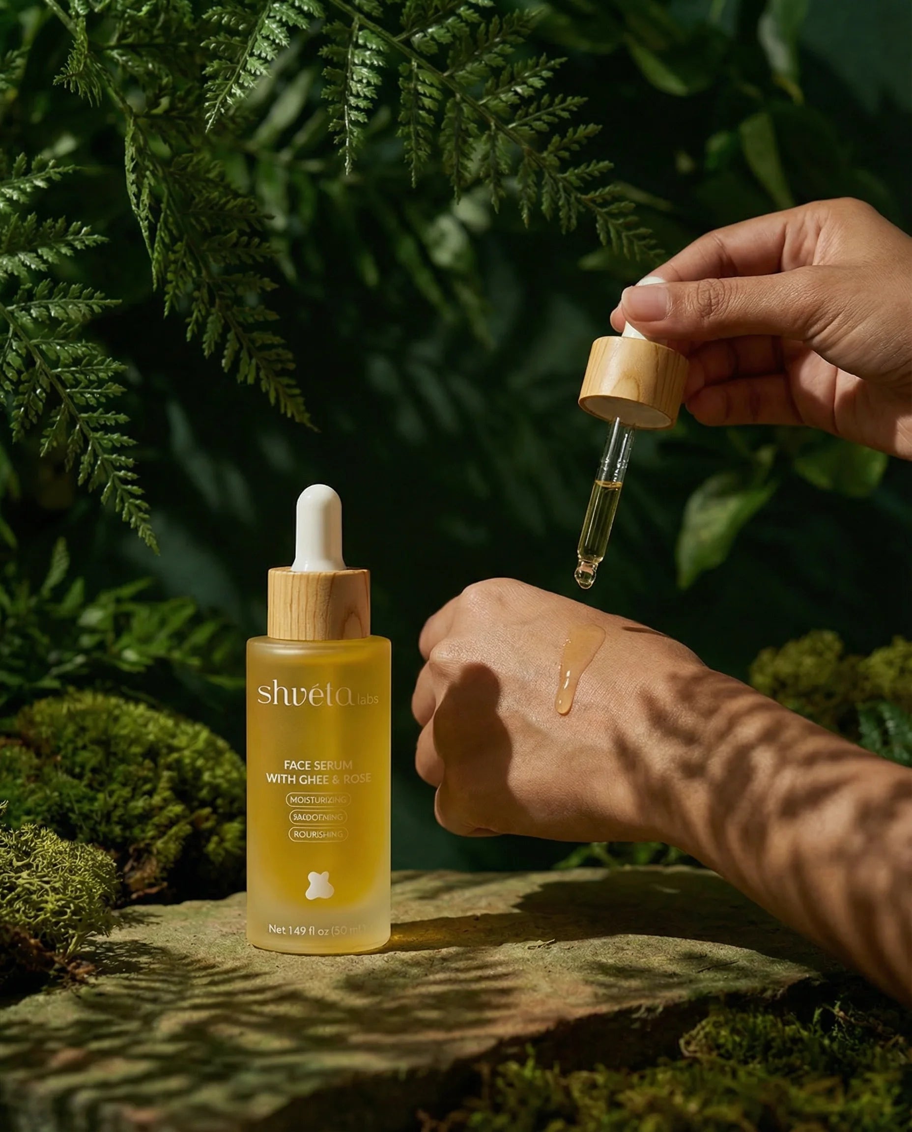 Shveta labs skincare dropper bottle with a hand holding a dropper over a natural background
